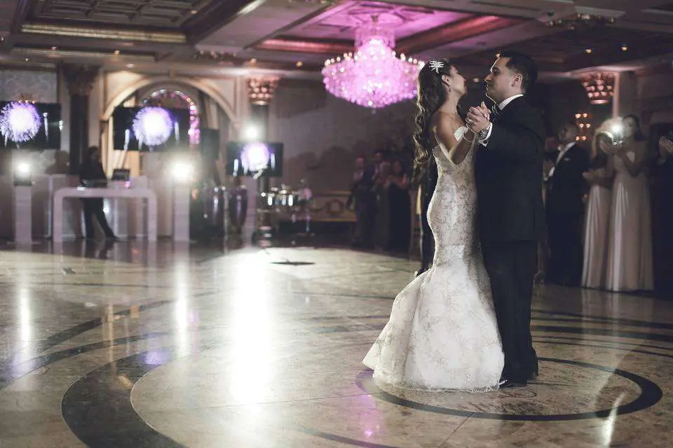 Bride and groom dancing on dance floor