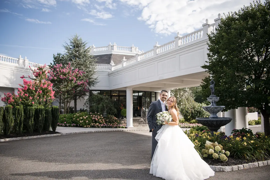 Bride and Groom in front of Mansion at Mountain Lakes