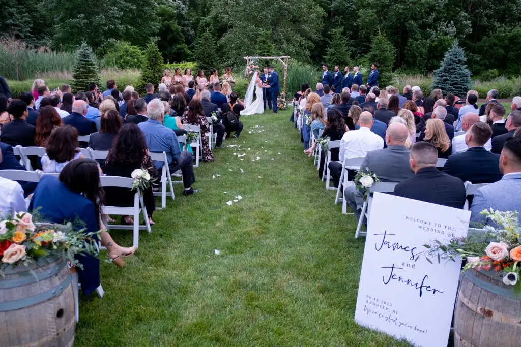 Wedding ceremony outside the Barn at Perona Farms in Andover, NJ
