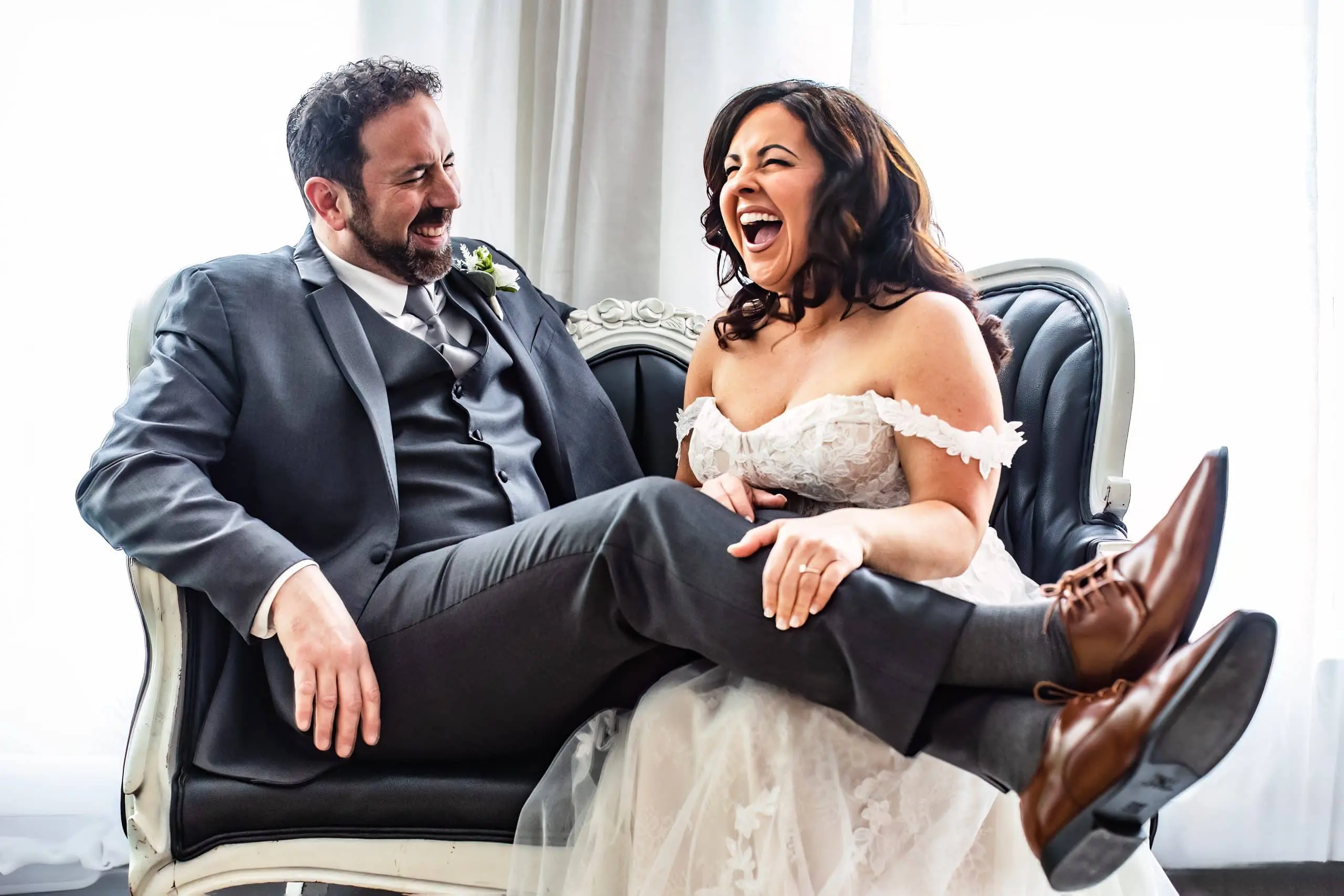 Bride laughing with groom