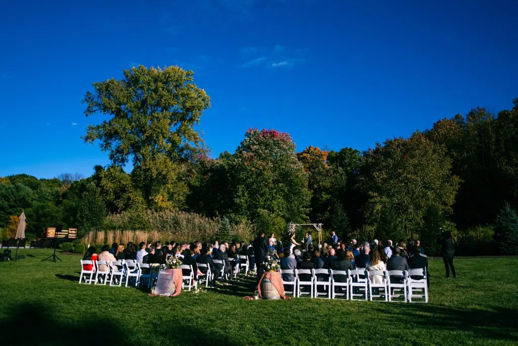 Wedding ceremony outside the Barn at Perona Farms in Andover, NJ