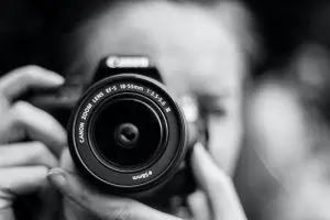 Photographer holding camera