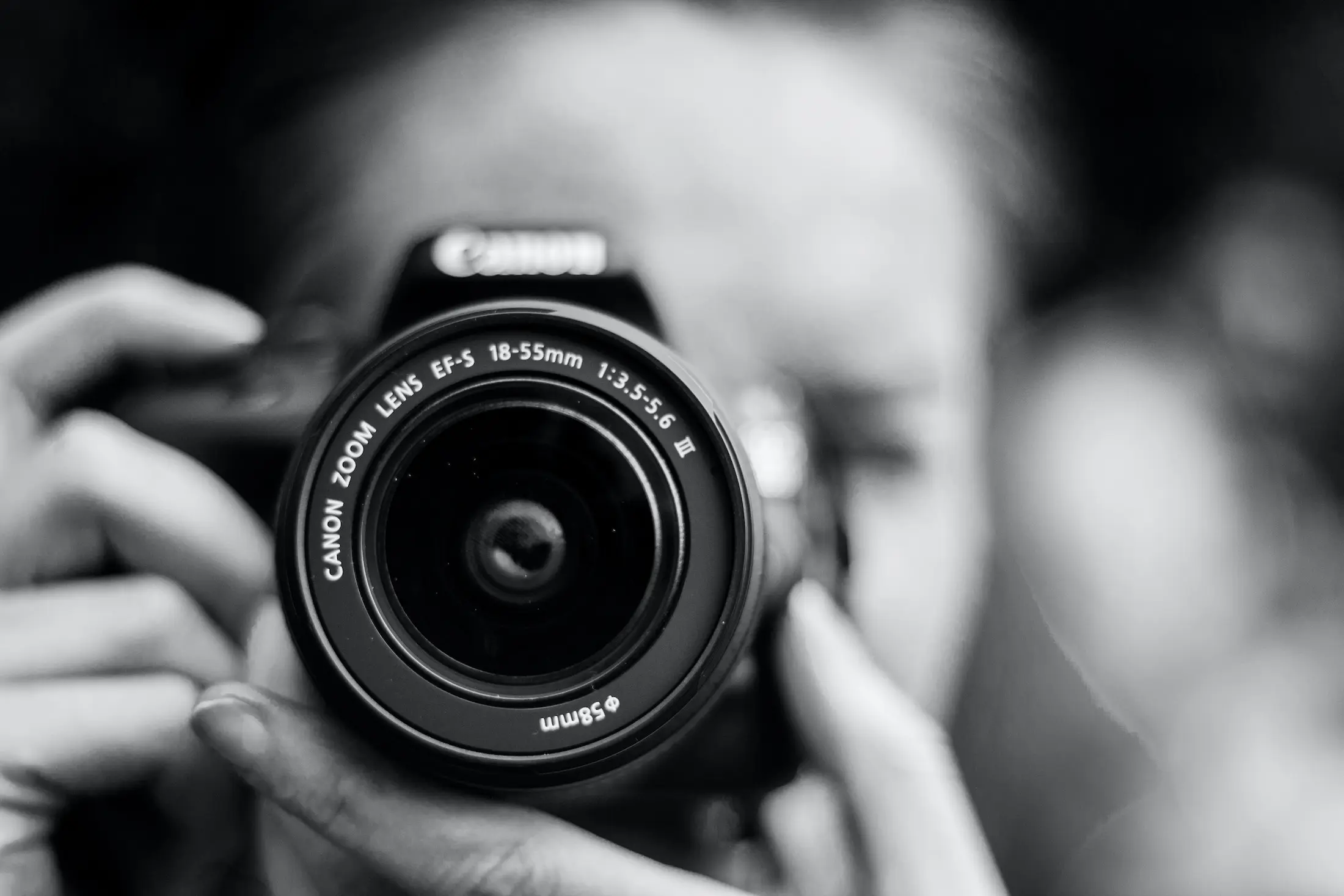 Photographer holding camera