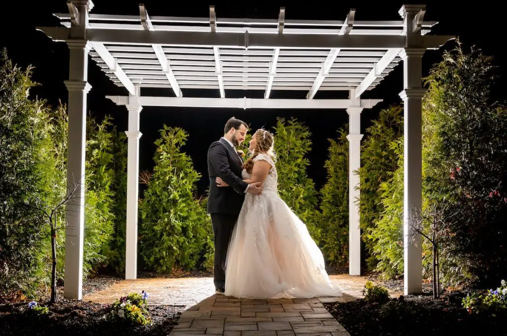 Bride and groom outside at night