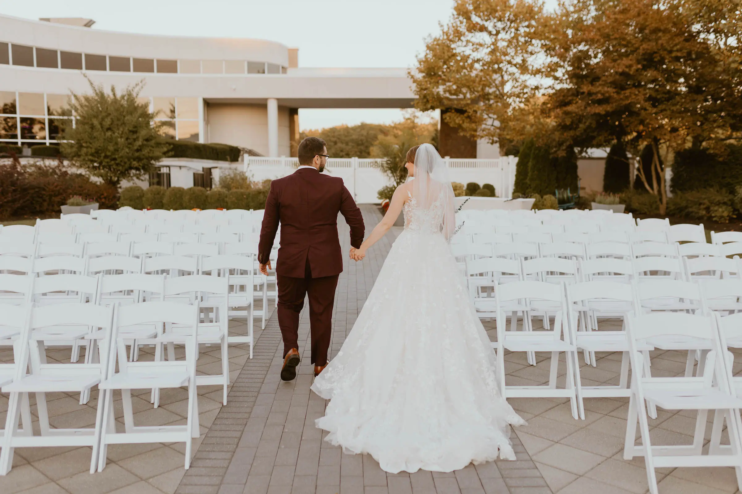 Bride and groom walking in aisle
