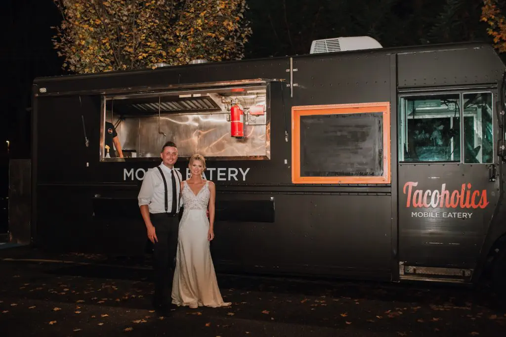 Bride and groom at food truck