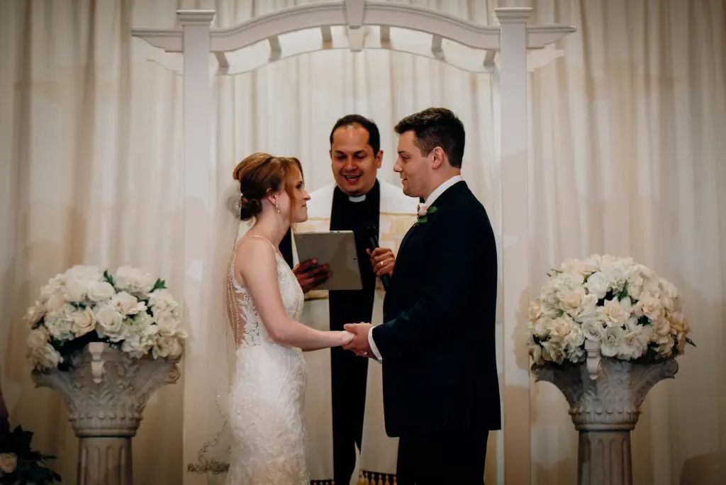 Bride and groom with officiant