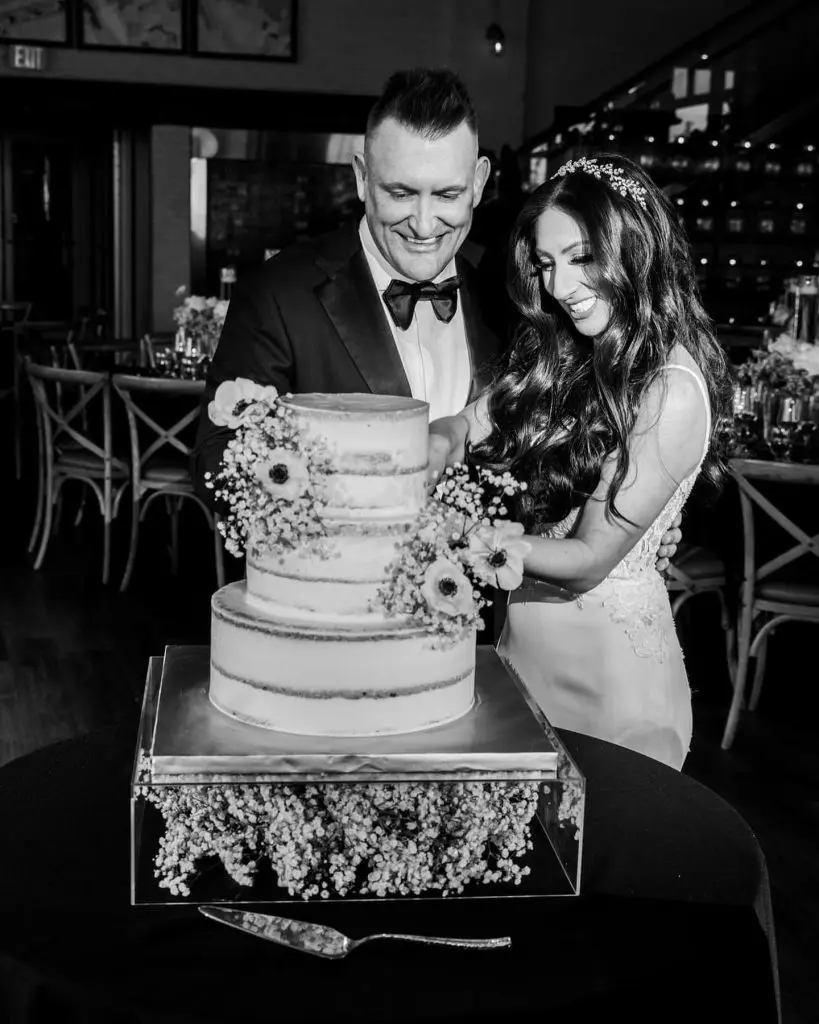 Bride and groom cutting cake