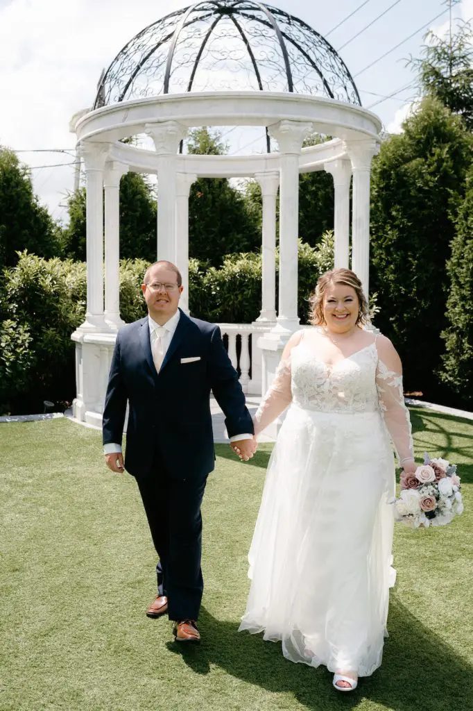 Bride and groom walking outdoors at The Grand