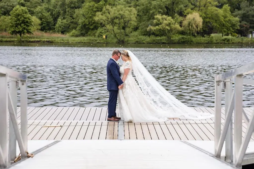 Bride and groom on dock