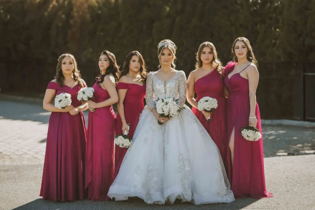 Bride and bridesmaids in magenta gowns