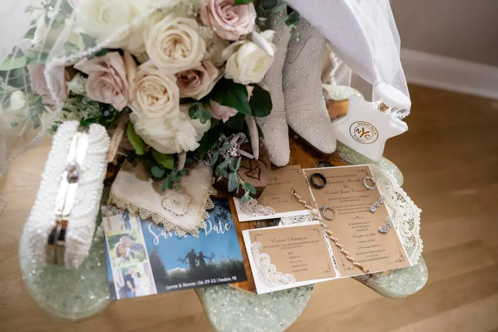 Wedding invitation and bouquet at wedding at Bear Brook Valley in Fredon, NJ