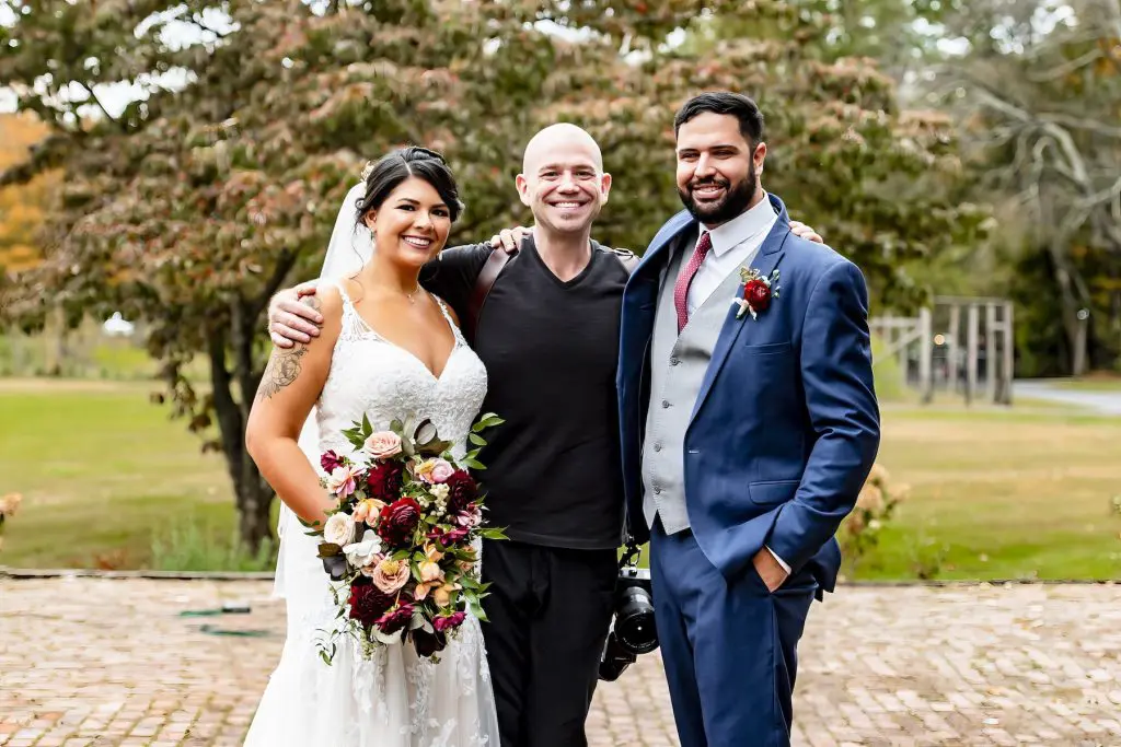 Bride and groom with photographer Daniel Nydick at Waterloo Village