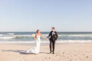 Bride and groom on beach at The Berkeley Oceanfront in Asbury Park, NJ