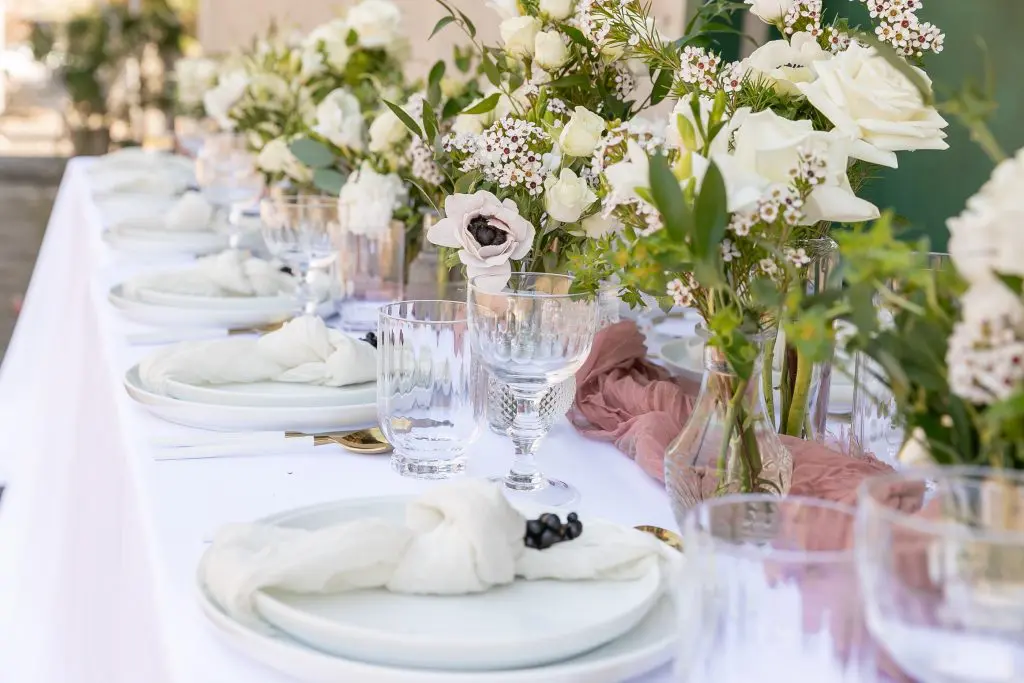 Custom wedding tablescape with china and glass rentals from Spoon + Salt.