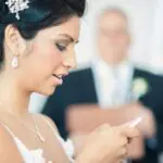 Bride looking at cell phone