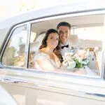 Bride and groom in Rolls-Royce at wedding at Park Avenue Club in Florham Park, NJ