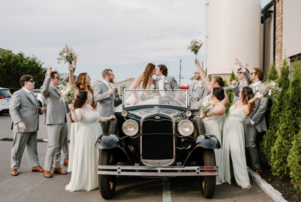 Bridal party in car at MudHen Brewing wedding in Wildwood, NJ