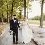 Bride and groom walking outside at Blue Heron Pines Golf Club, NJ
