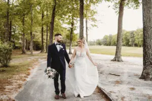 Bride and groom walking outside at Blue Heron Pines Golf Club, NJ