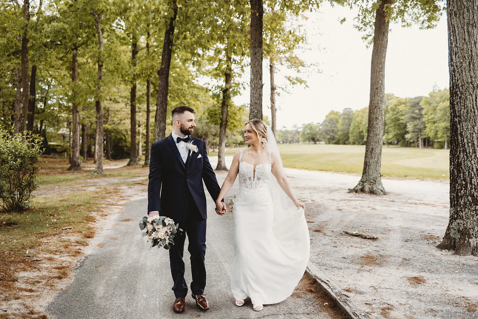Bride and groom walking outside at Blue Heron Pines Golf Club, NJ