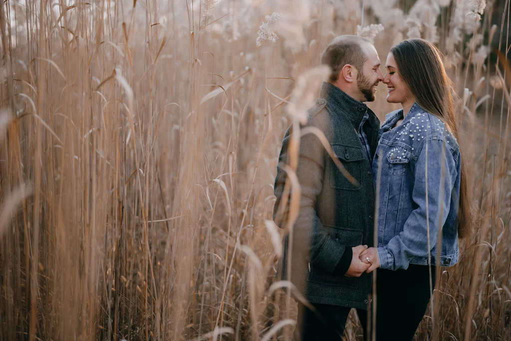 Bride and groom's engagement shoot in field with Fresh New Angle Events in Toms River, NJ