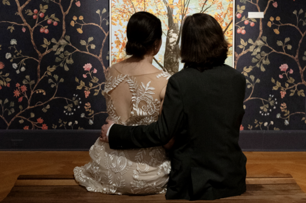 Bride and groom enjoying museum exhibit during wedding at Morris Museum in Morristown, NJ