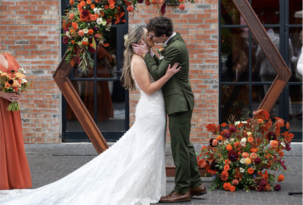 Bride and groom kissing at MudHen Brewing wedding in Wildwood, NJ